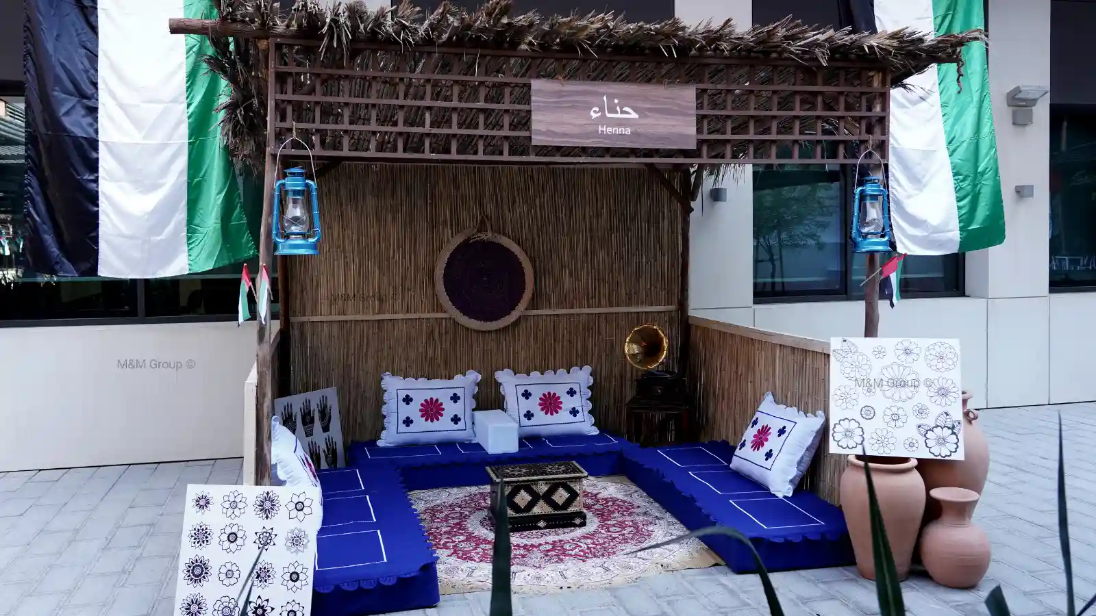 Areesh henna tent with traditional seating and UAE flag décor for flydubai UAE National Day celebration in Dubai